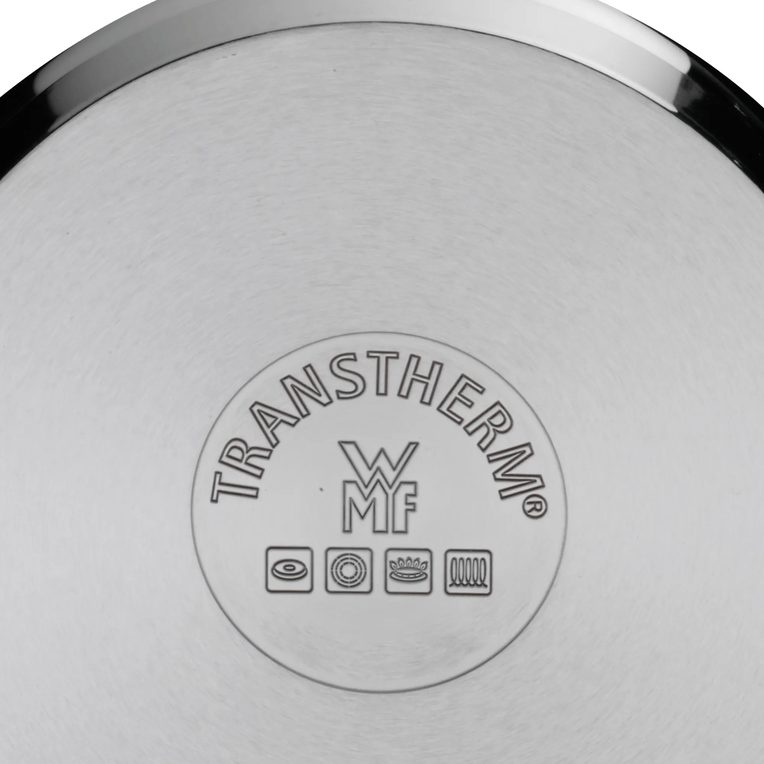 WMF TRANSTHERM Logo mit Kochsymbolen auf poliertem Metallboden.