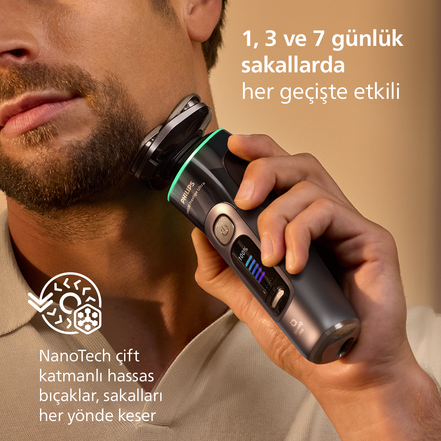 Bir erkek Philips tıraş makinesiyle sakalını tıraş ediyor. Tıraş makinesinde dijital ekran var.