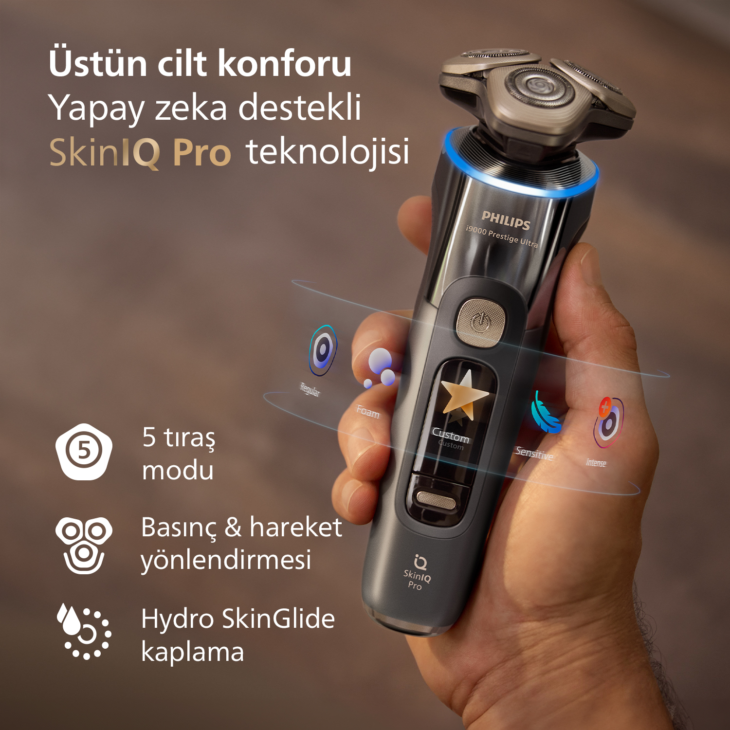 El, 5 modu gösteren SkinIQ Pro teknolojili Philips tıraş makinesi tutuyor.