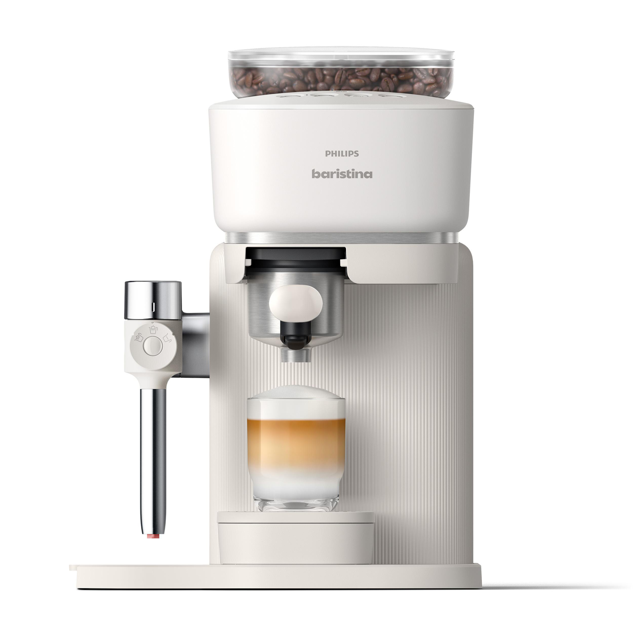 Eine weiße Philips Baristina Kaffeemaschine mit einem Glas Latte Macchiato.