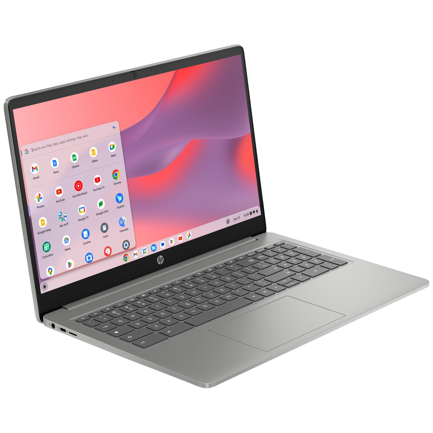 A silver laptop with its screen open, displaying Google apps.