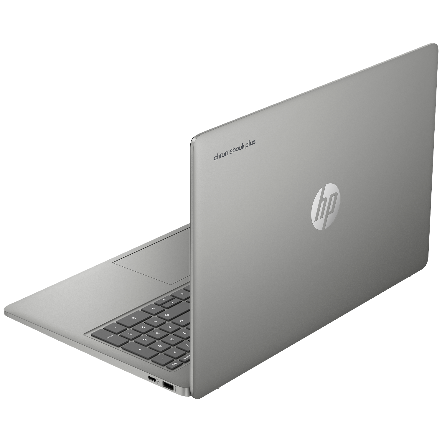 A silver HP Chromebook Plus laptop, viewed from an oblique top angle, showing the keyboard.