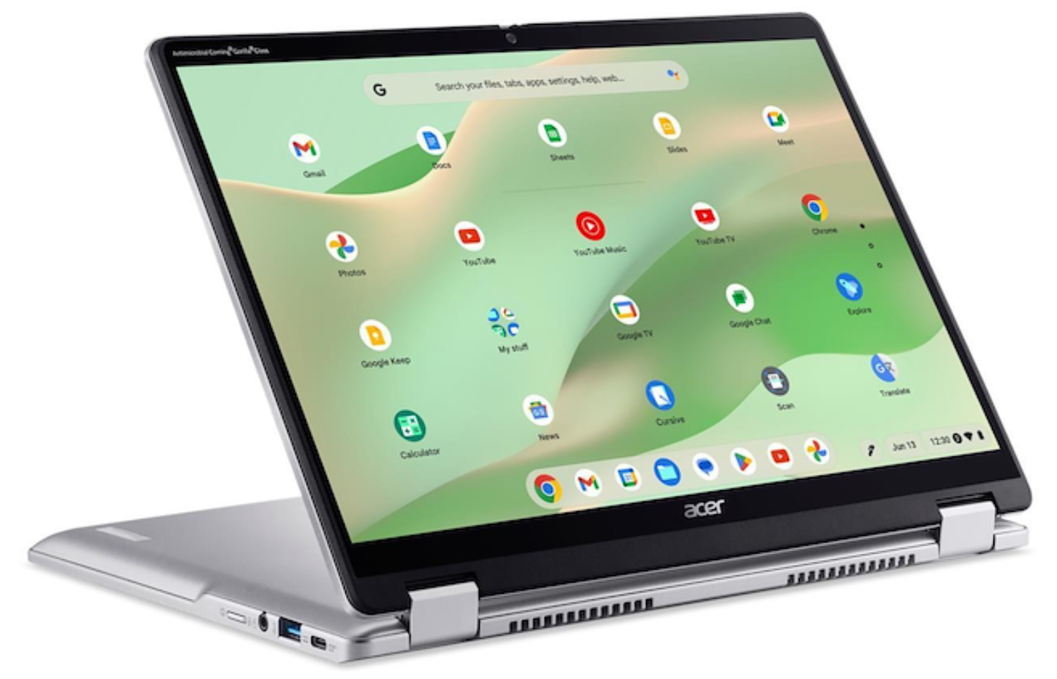 Chromebook Acer plateado abierto mostrando la pantalla con apps de Google y barra de búsqueda.