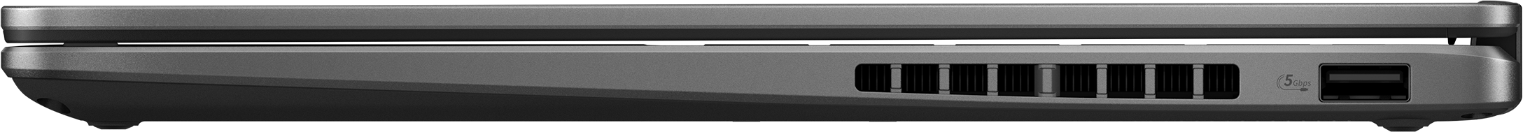 Die Seitenansicht eines geschlossenen grauen Laptops mit Lüftungsschlitzen und einem USB-Anschluss.