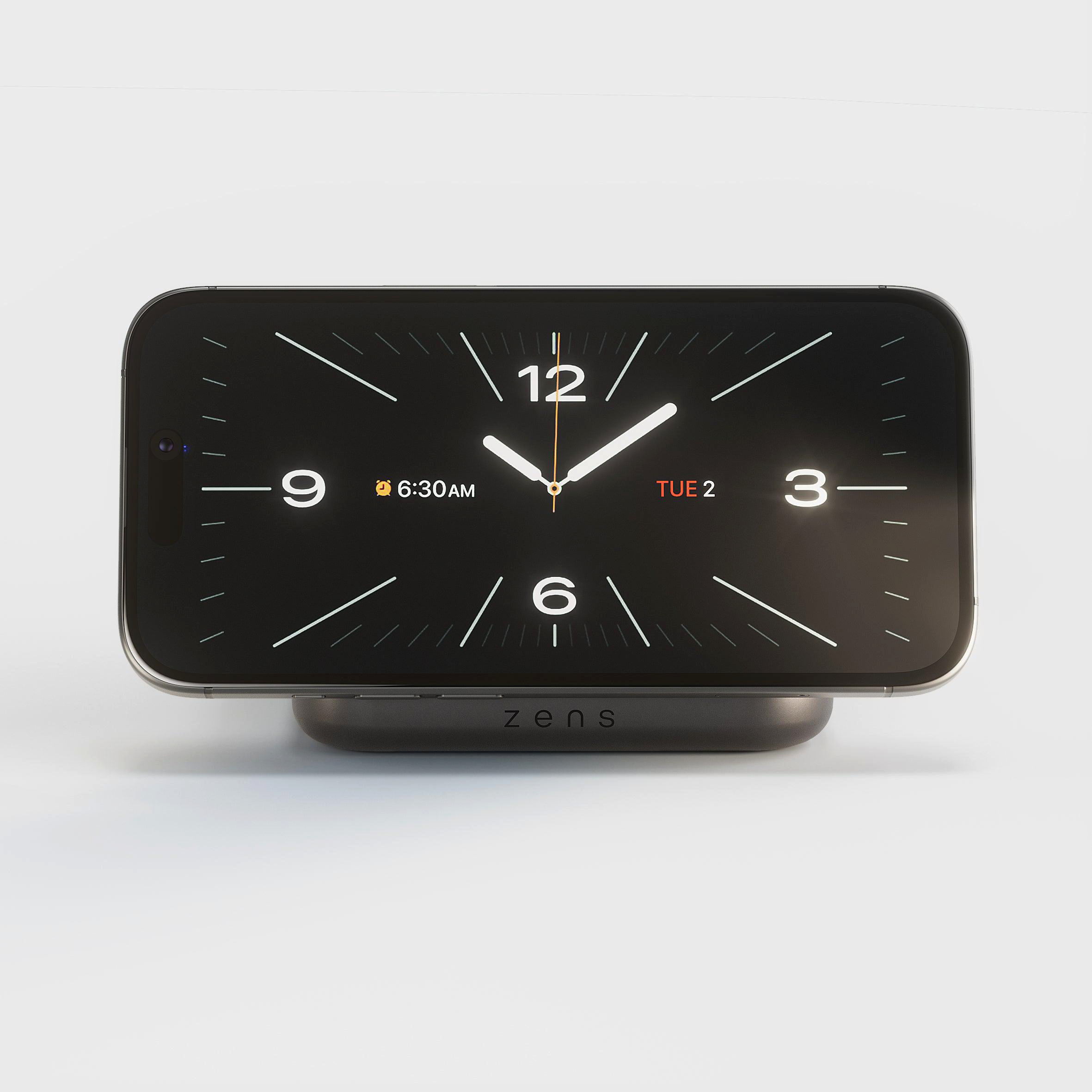 Smartphone im Querformat mit Uhranzeige auf Ladestation. 6:30 Uhr, Di 2.