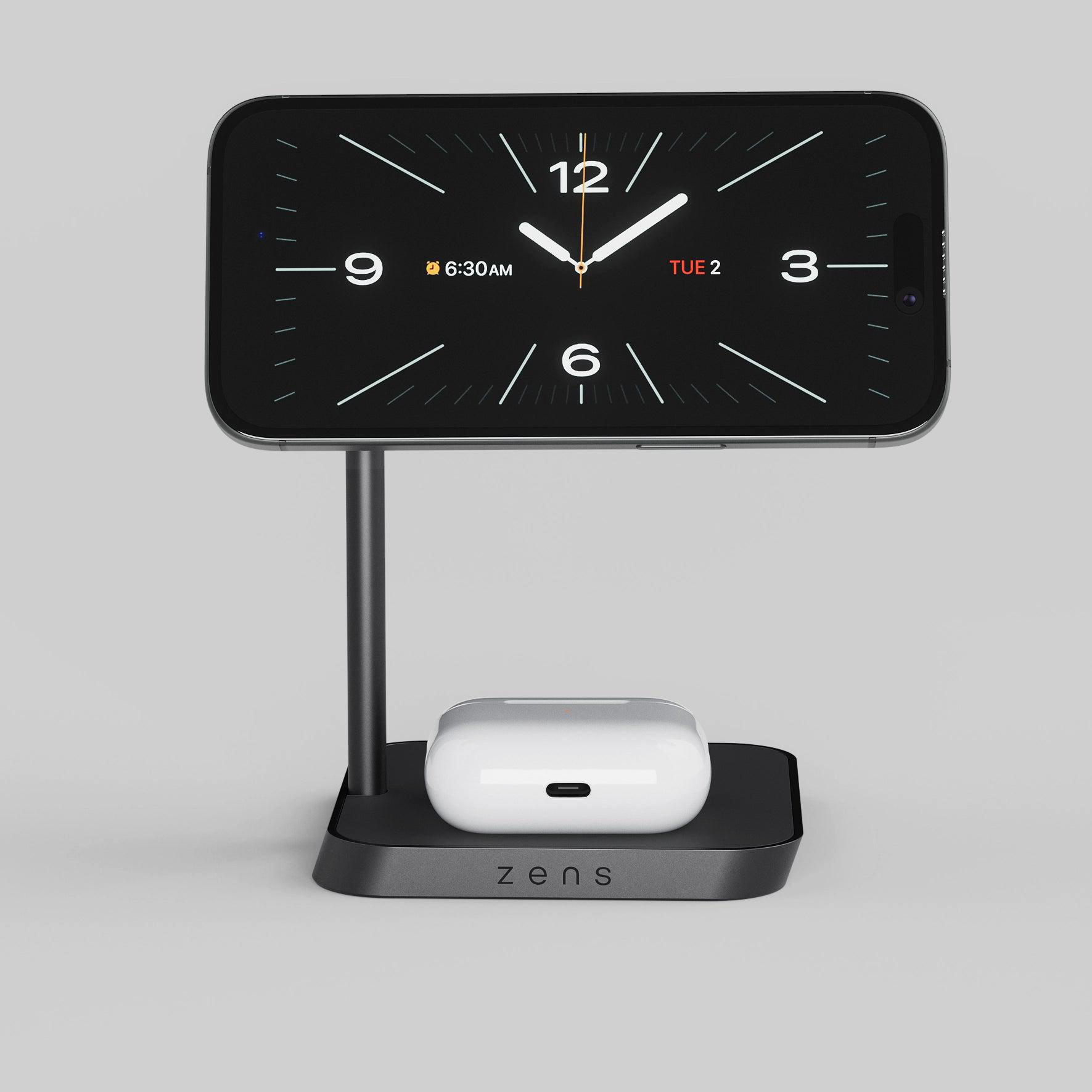 Ein Smartphone auf einem Ständer mit Ladebox für Ohrhörer.