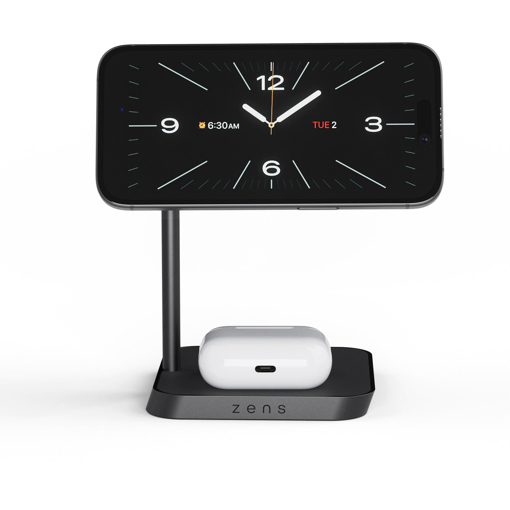 Ein Smartphone steht auf einem schwarzen Ladegerät mit AirPods. Die Uhrzeit ist 6:30 Uhr.