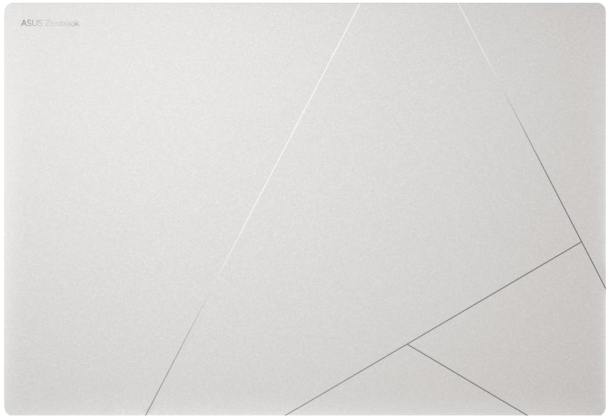 Ezüst laptopfedél geometrikus vonalakkal.