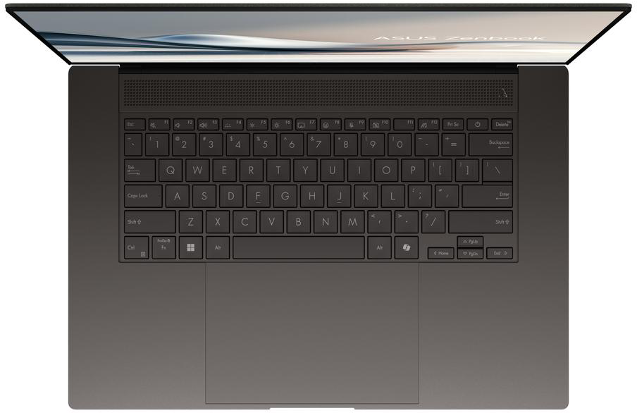 Sötét laptop felülnézetben, megvilágított billentyűzettel és képernyővel.