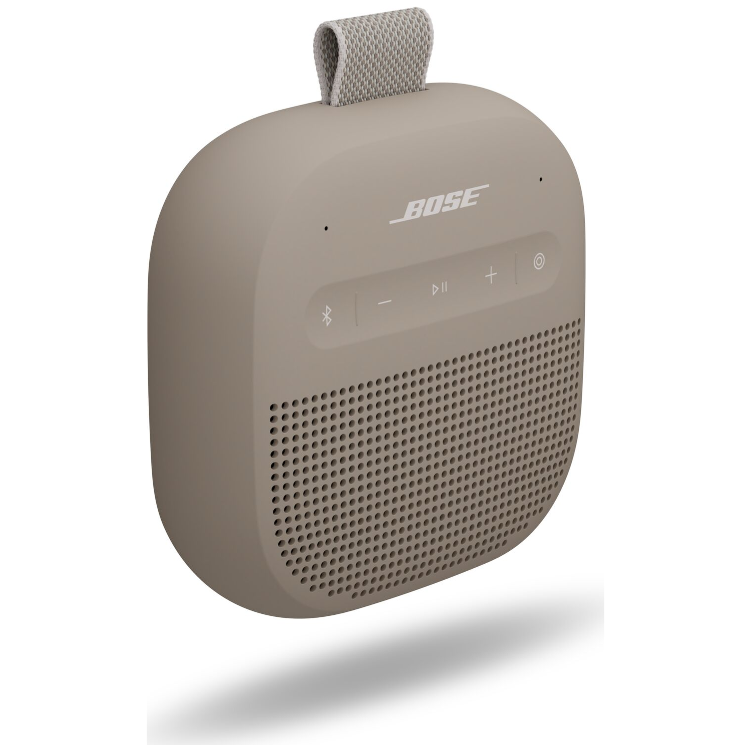Een beige Bose speaker met volumeknoppen en draagband.