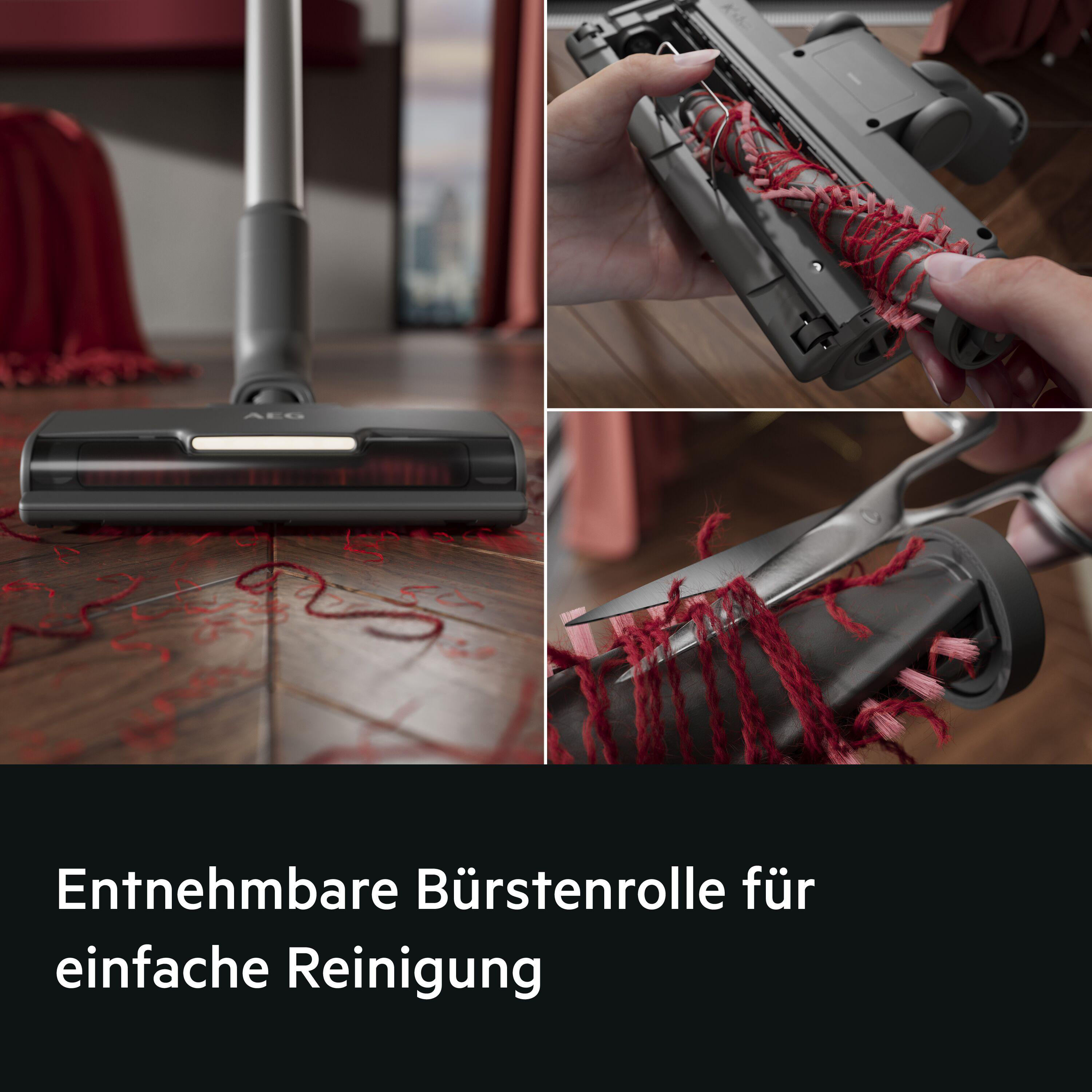 Grauer Staubsaugeraufsatz mit rotem Garn, das abgeschnitten wird.