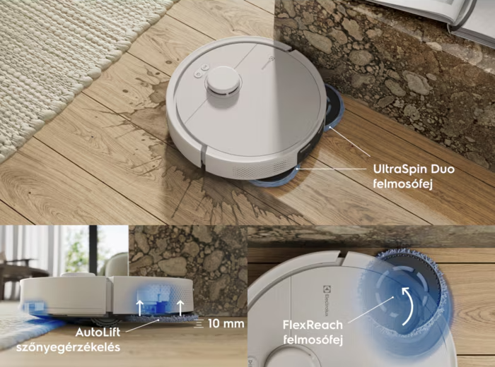 Egy fehér robotporszívó tisztít egy fapadlót márványfal mellett.