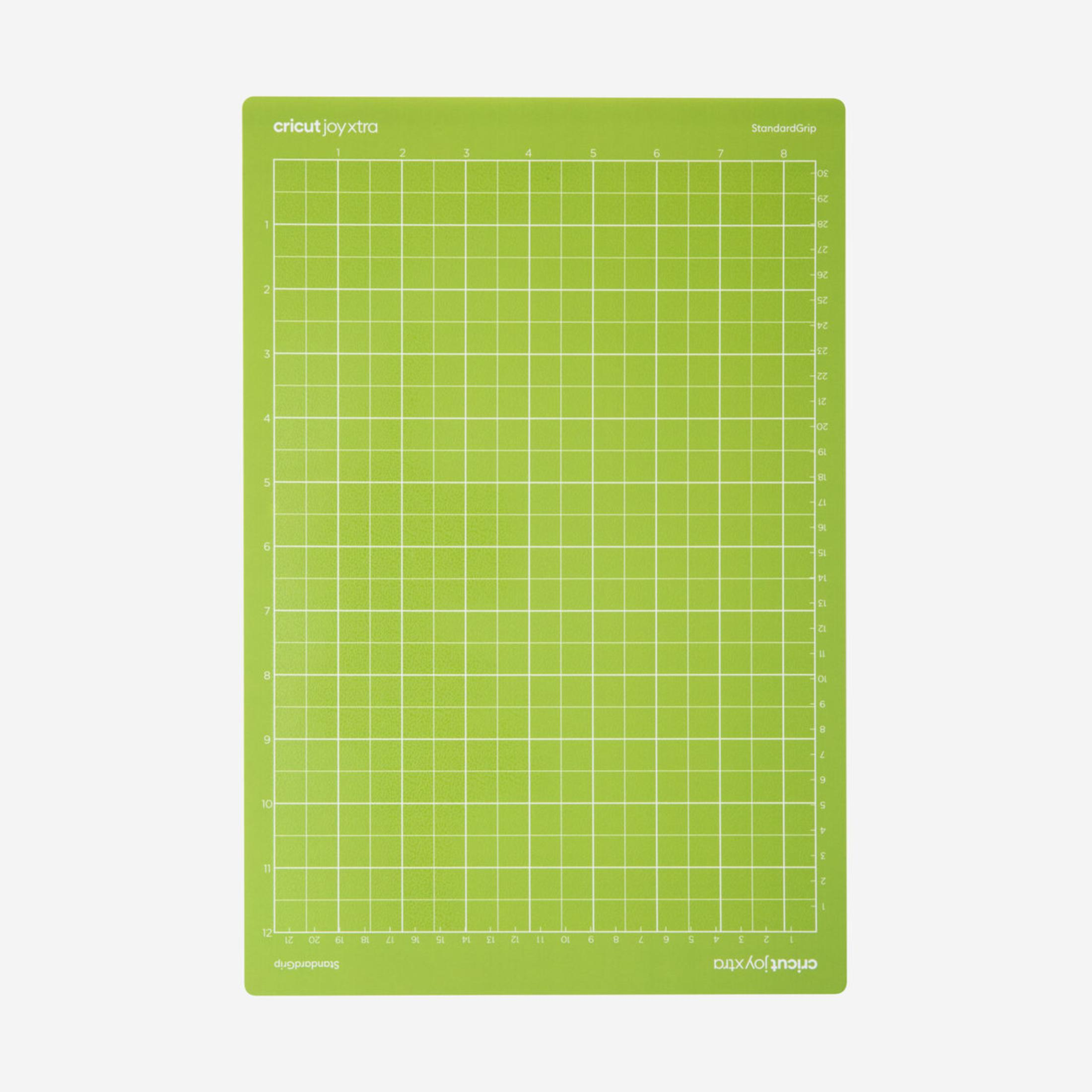 Alfombrilla de corte Cricut Joyxtra verde con líneas de rejilla y números blancos.