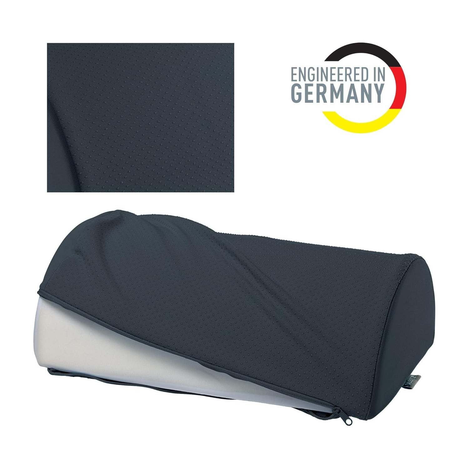 Cuscino a cuneo grigio scuro con perforazioni e cerniera, logo 'Engineered in Germany'.
