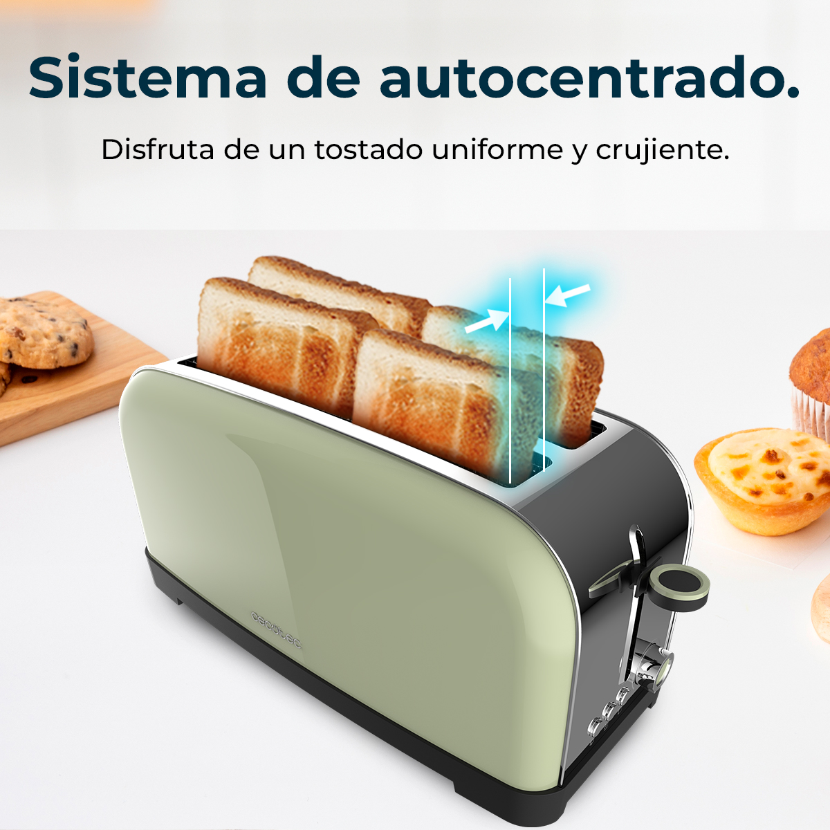 Una tostadora verde con cuatro rebanadas de pan y galletas al lado.