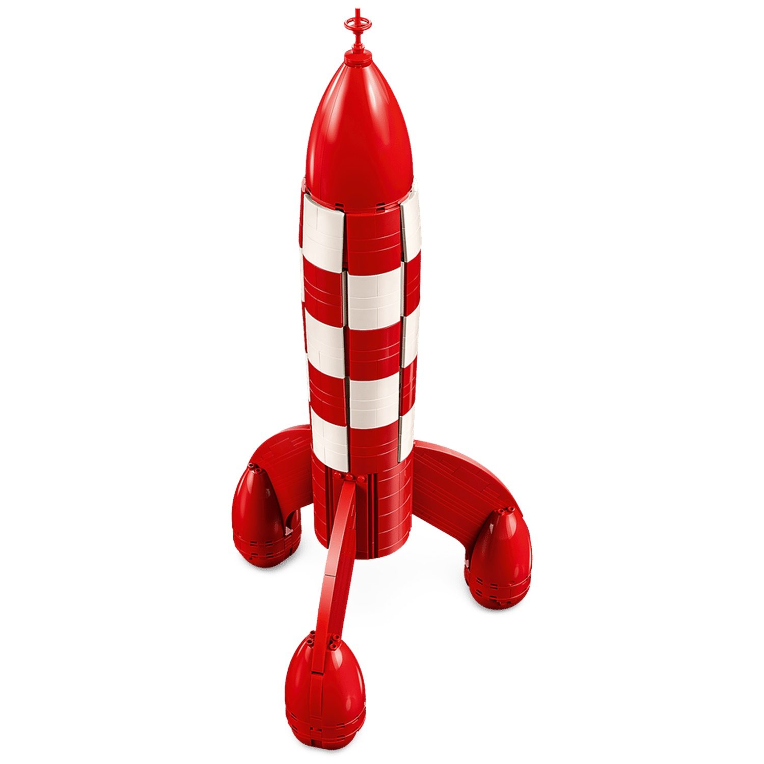 A red and white rocket model made of blocks, with three legs and a pointed top.