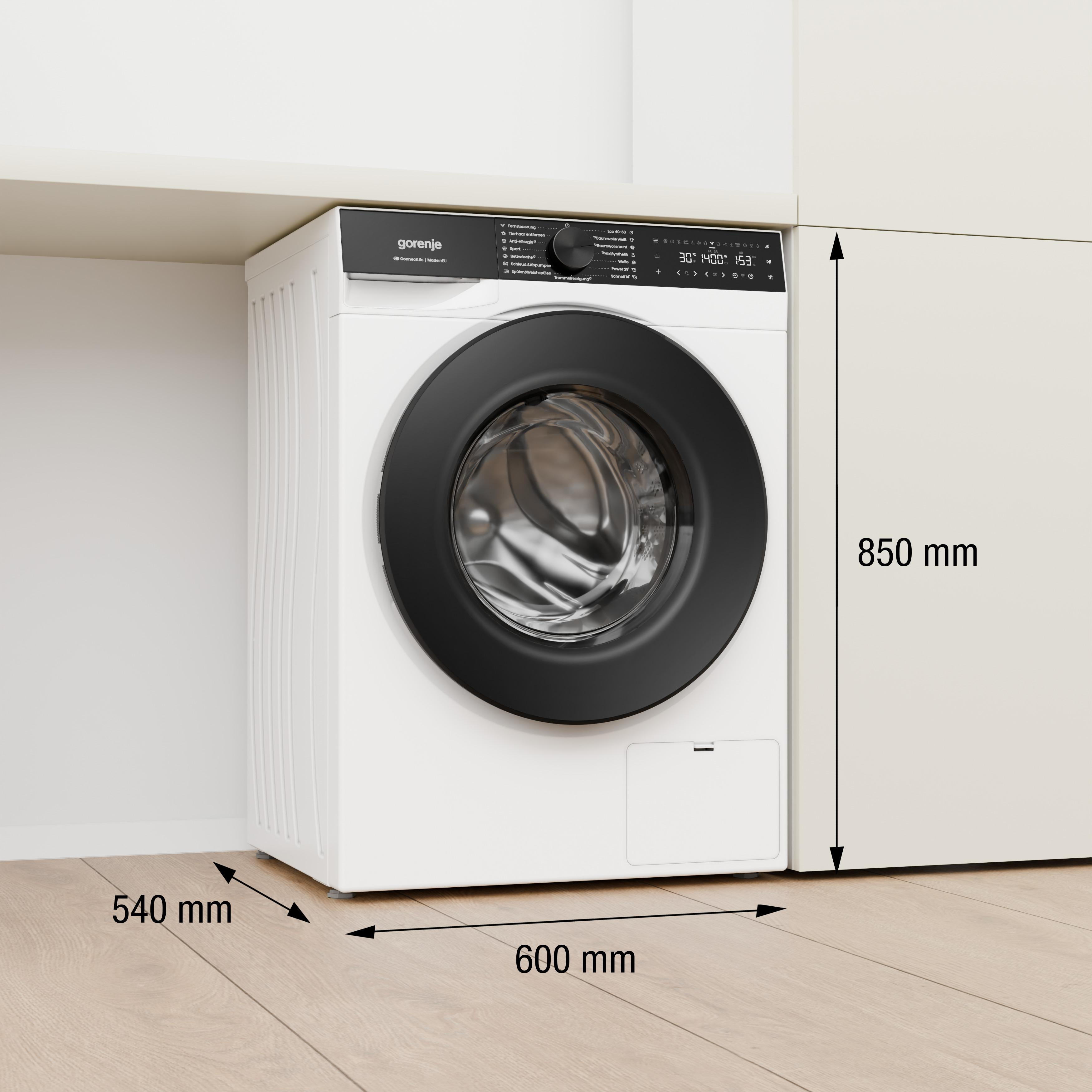 Weiße Gorenje Waschmaschine mit schwarzer Tür unter einem Regal. Maße: 600x540x850mm.