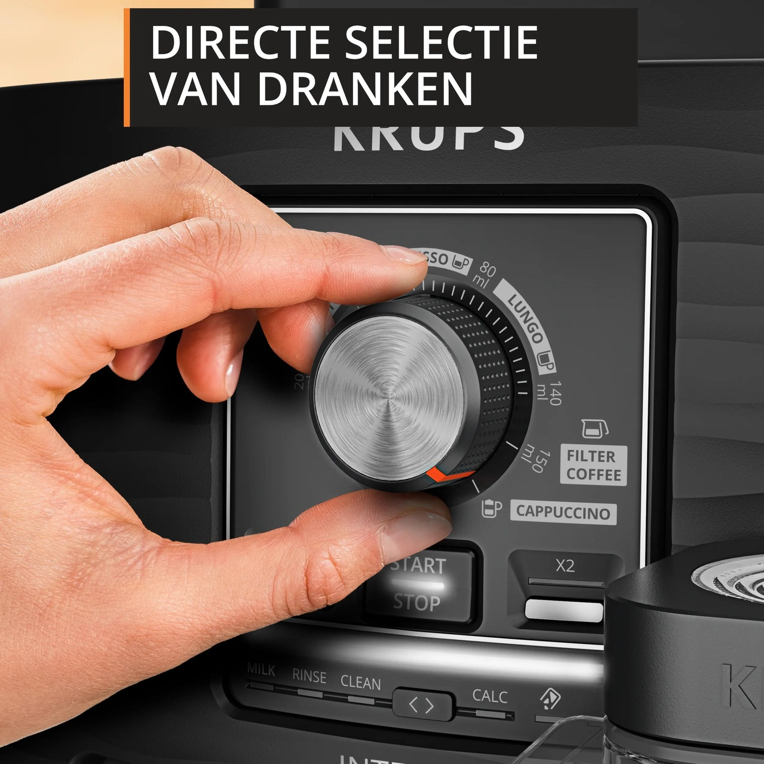 A hand turns a dial on a coffee machine with control buttons.