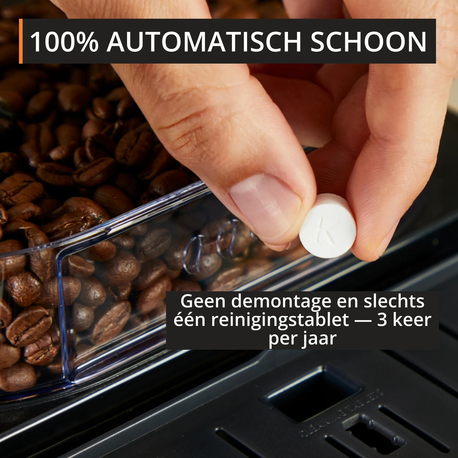 A hand holds a white cleaning tablet over coffee beans and a coffee machine.