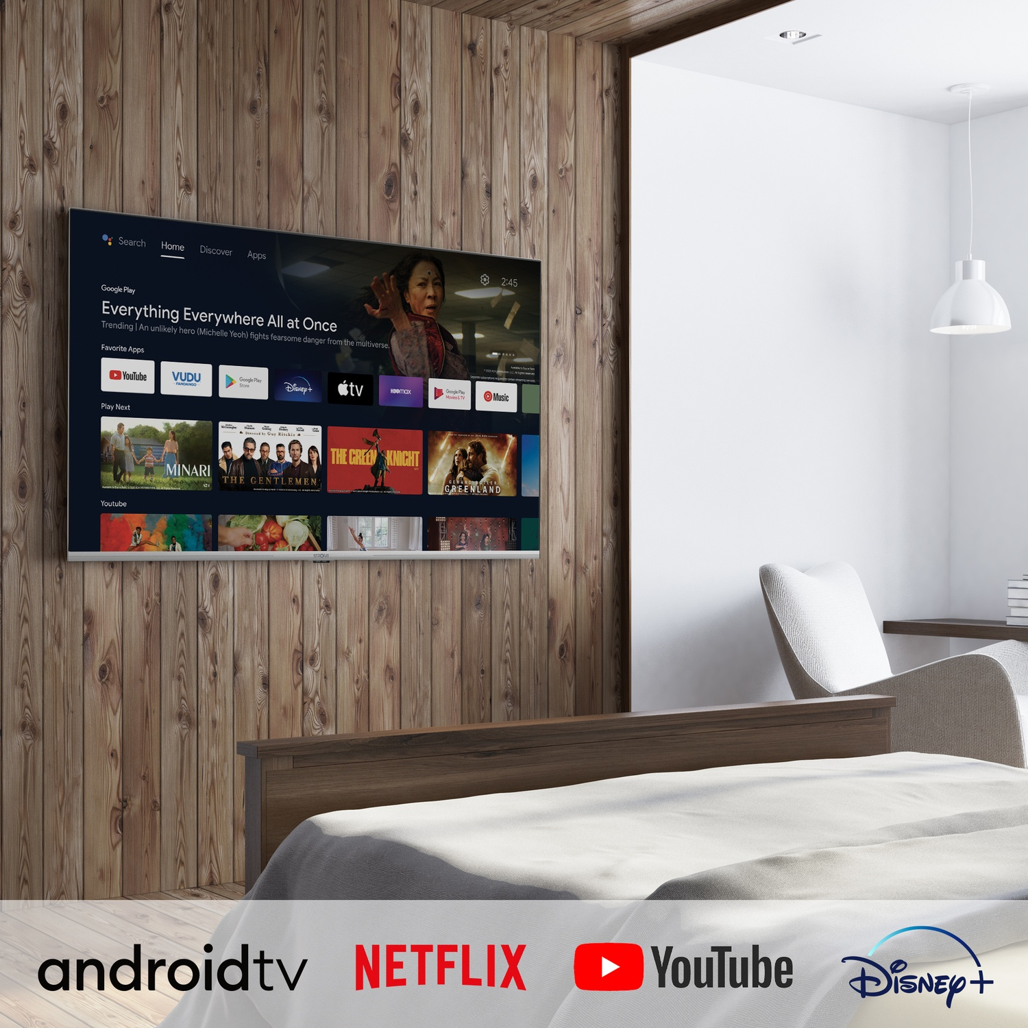 Una camera da letto con una TV che mostra Android TV, con app come YouTube e Netflix.