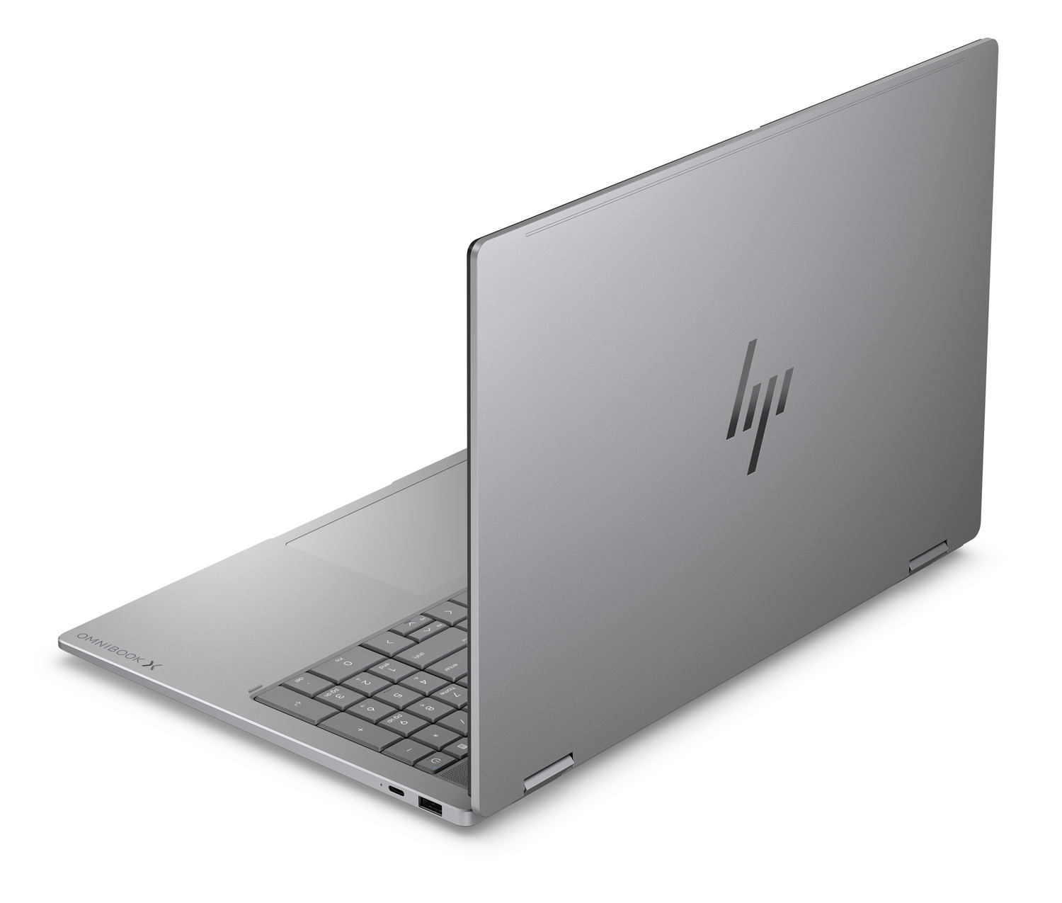 Un portátil plateado HP cerrado con el logo de HP en la tapa.