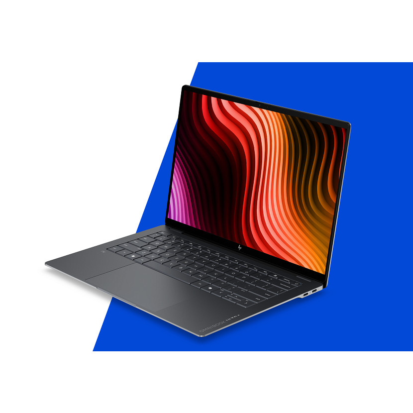 Ciemnoszary laptop HP z kolorową abstrakcyjną tapetą na ekranie.