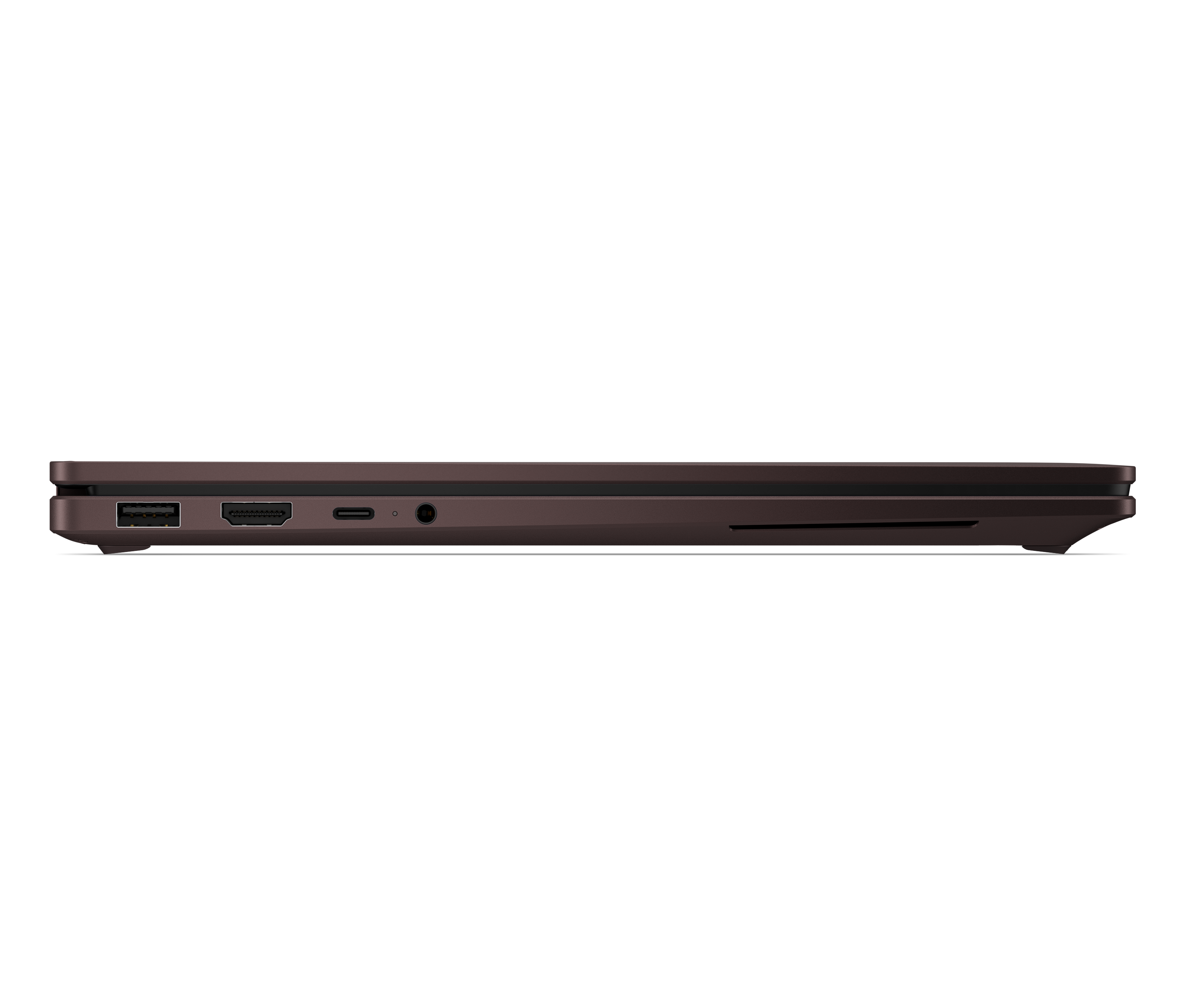 Widok z boku zamkniętego brązowego laptopa, pokazujący porty USB, USB-C i audio.