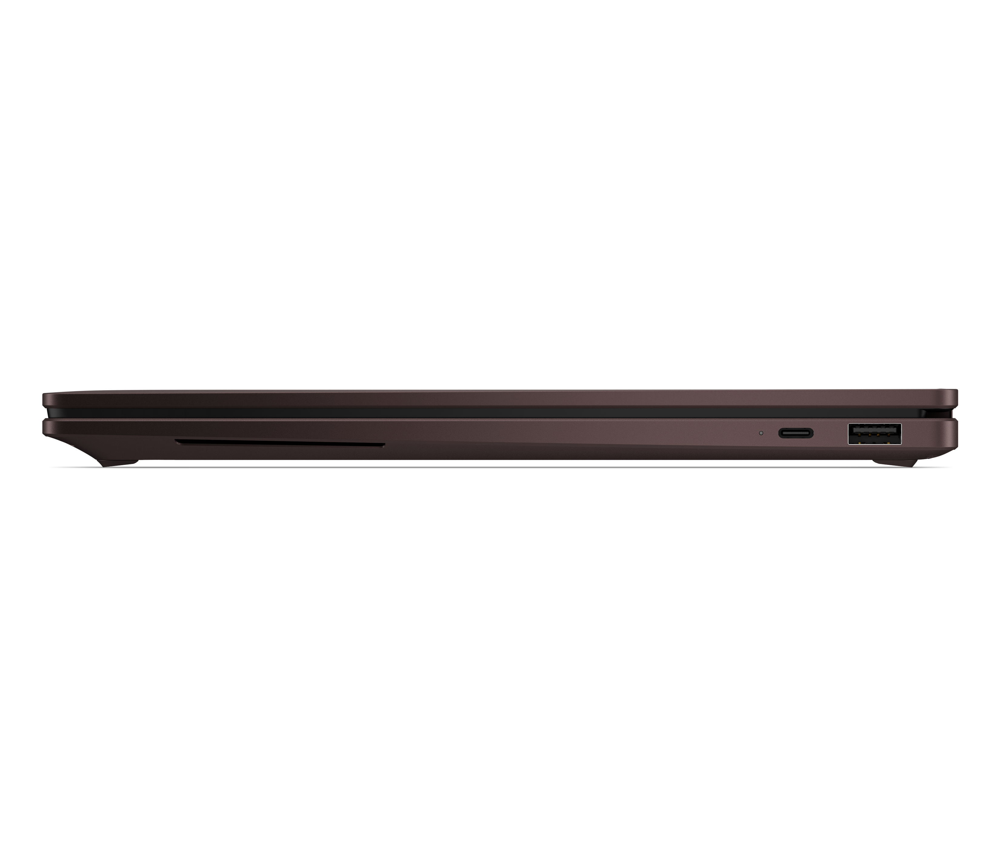 Brązowy bok laptopa z portami USB i USB-C na czarnym tle.