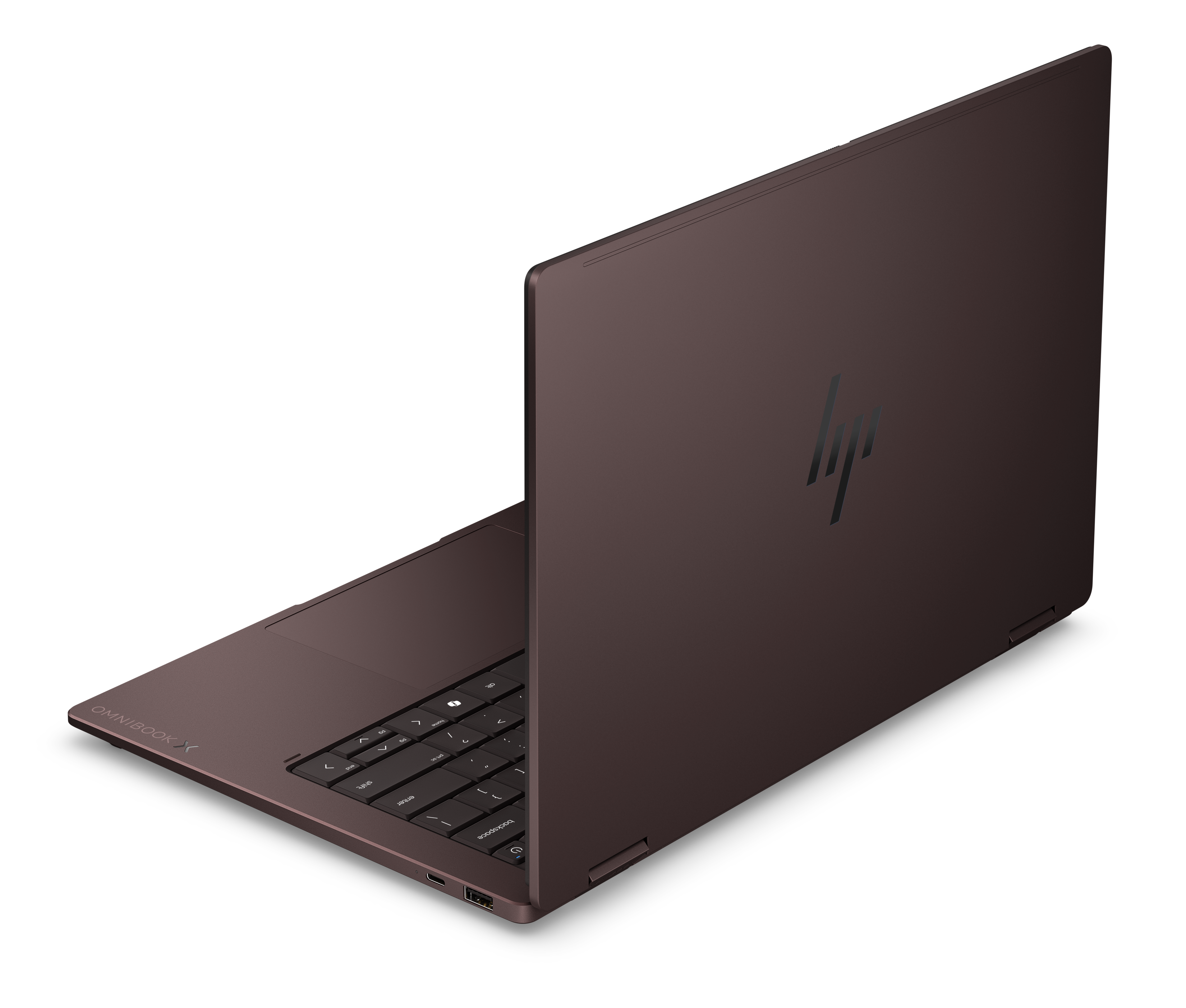 Zamknięty, brązowy laptop HP Omnibook X z podświetlaną klawiaturą i logo.