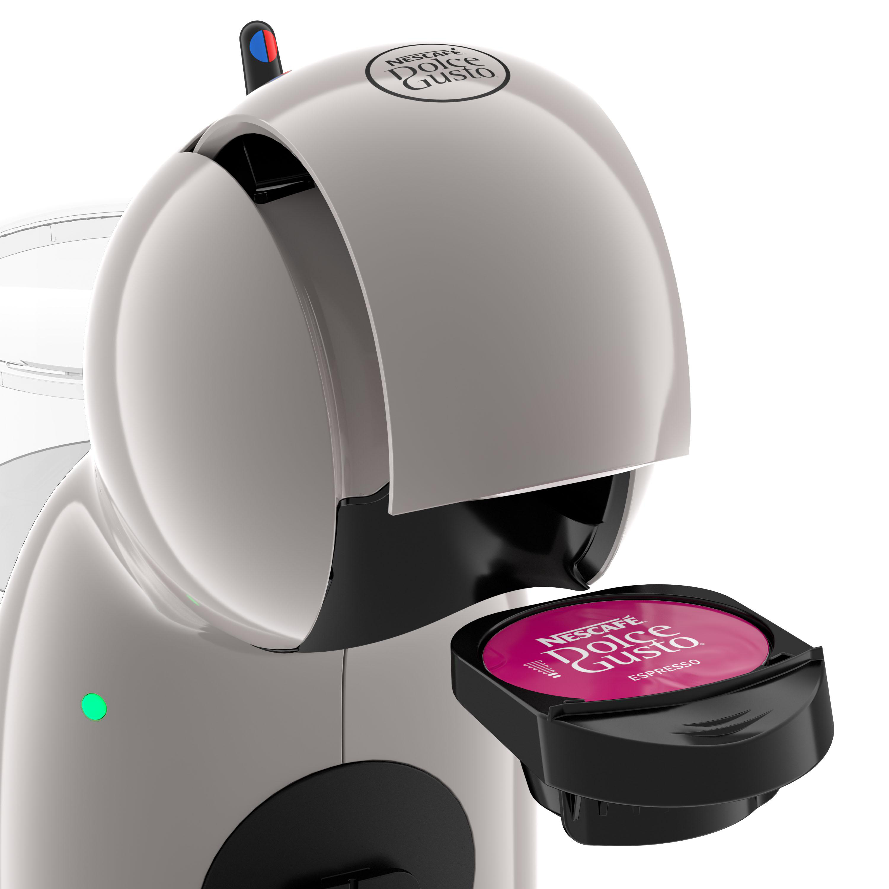 Eine weiße Dolce Gusto Kaffeemaschine mit roter Espresso-Kapsel.