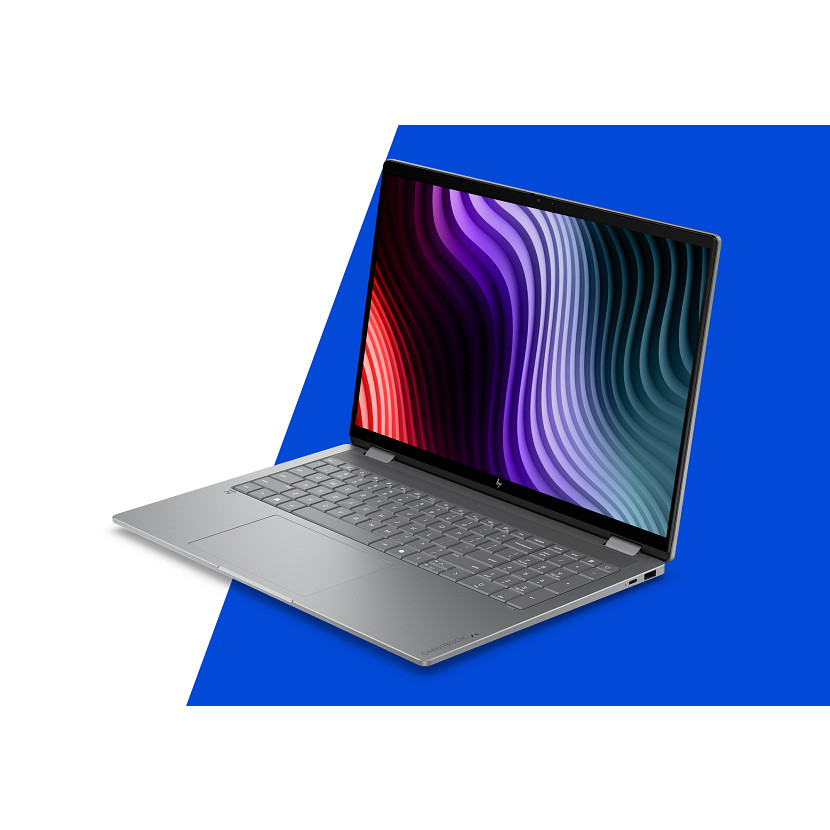 Ein silberner Laptop mit einem farbenfrohen, wellenförmigen Hintergrund.