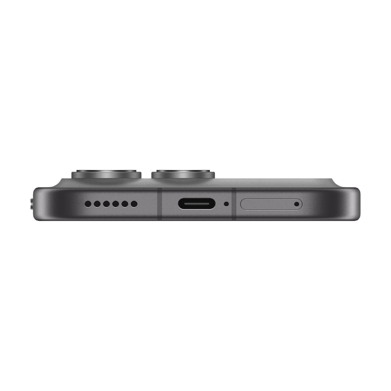 Primo piano di uno smartphone scuro che mostra la porta USB-C e le griglie degli altoparlanti.