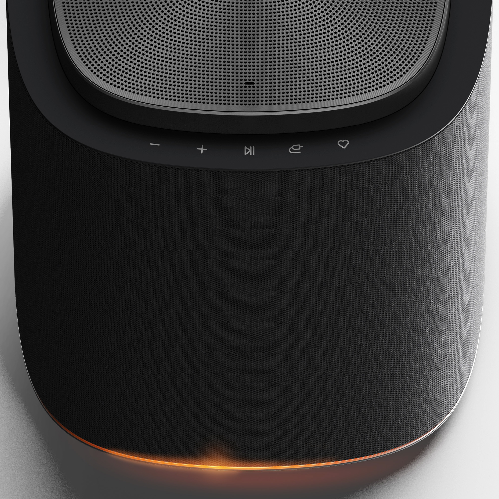 Altavoz negro con controles táctiles y anillo iluminado en la base.