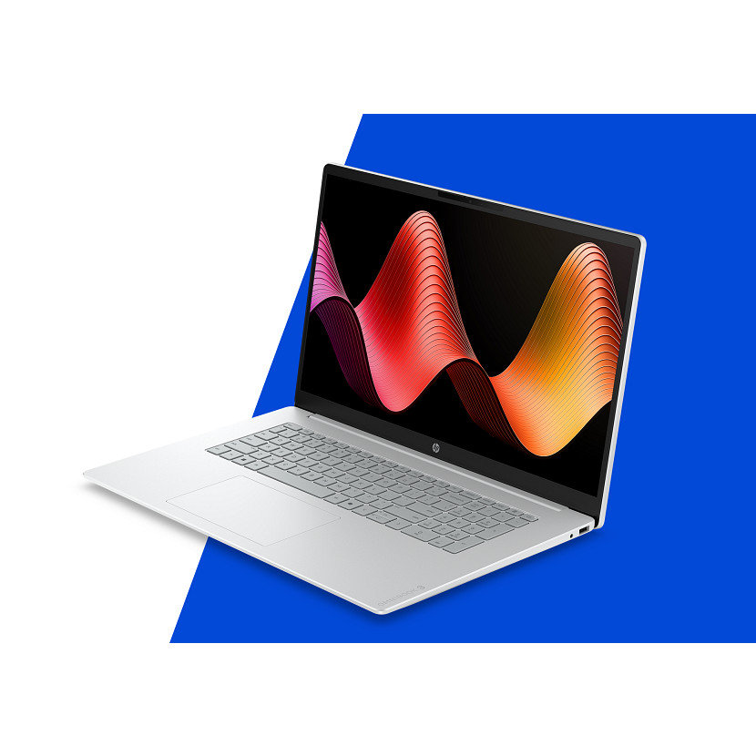 Ein offener silberner Laptop mit einem bunten Wellenmuster auf dem Bildschirm.