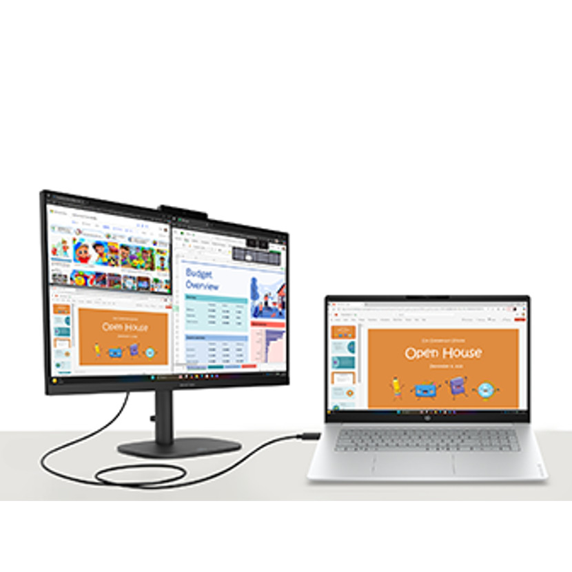 Ein Monitor und ein Laptop sind über Kabel verbunden und zeigen Präsentationen.