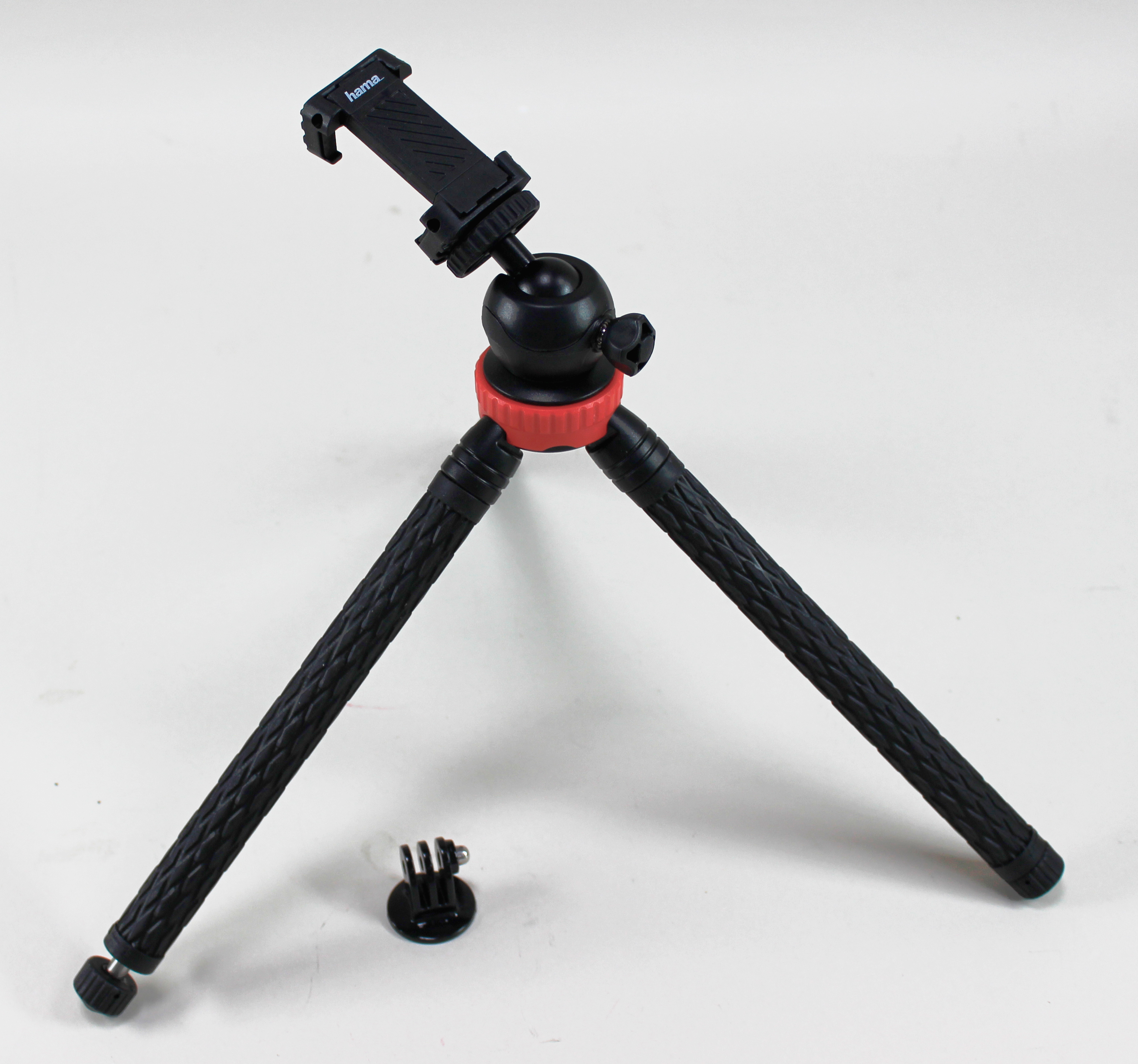Kırmızı halkalı ve telefon tutuculu siyah Hama tripod.