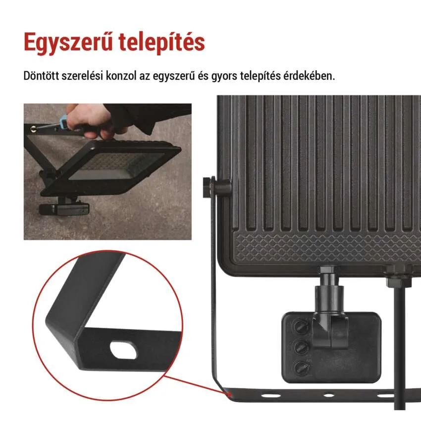 Fekete reflektor falra szerelve. Közelkép a tartóról.