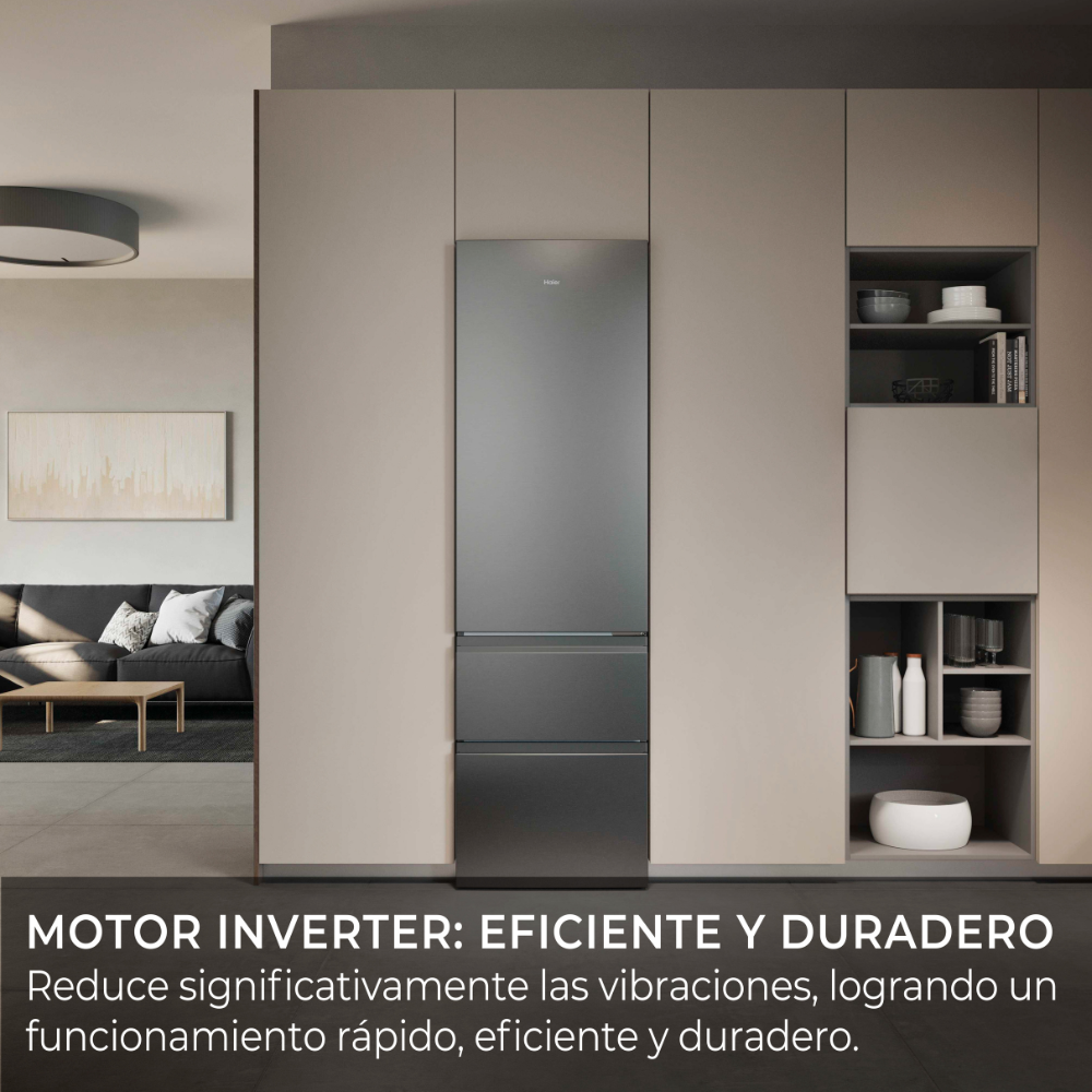 Moderna área de cocina con refrigerador gris y sala de estar contigua.