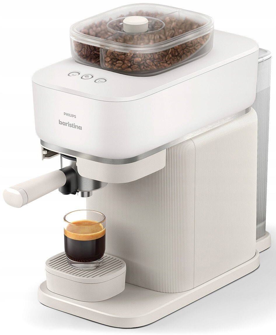 Biała maszyna do kawy z pojemnikiem na ziarna i szklanką espresso.