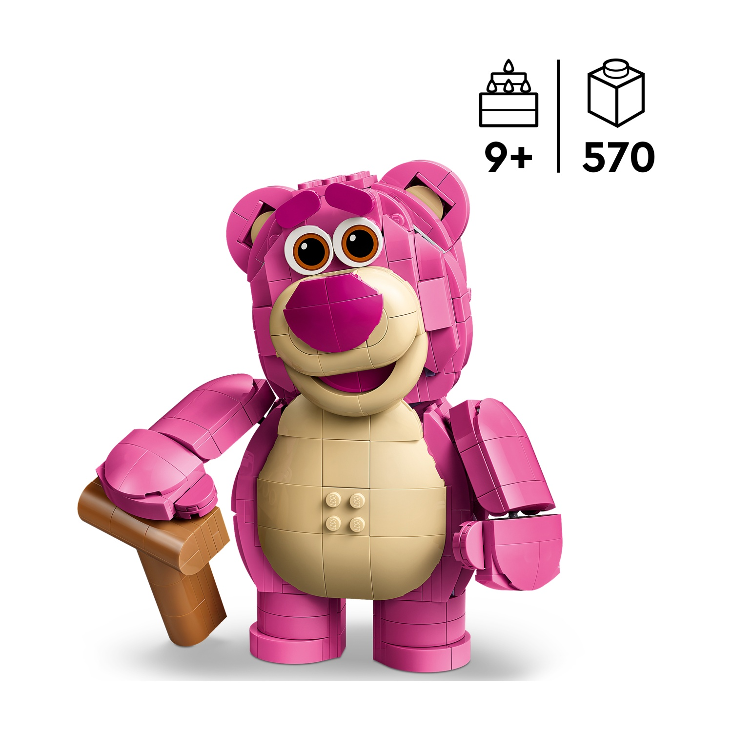 Orso Lotso Lego rosa con pancia beige tiene oggetto marrone. Età 9+, 570 pezzi.