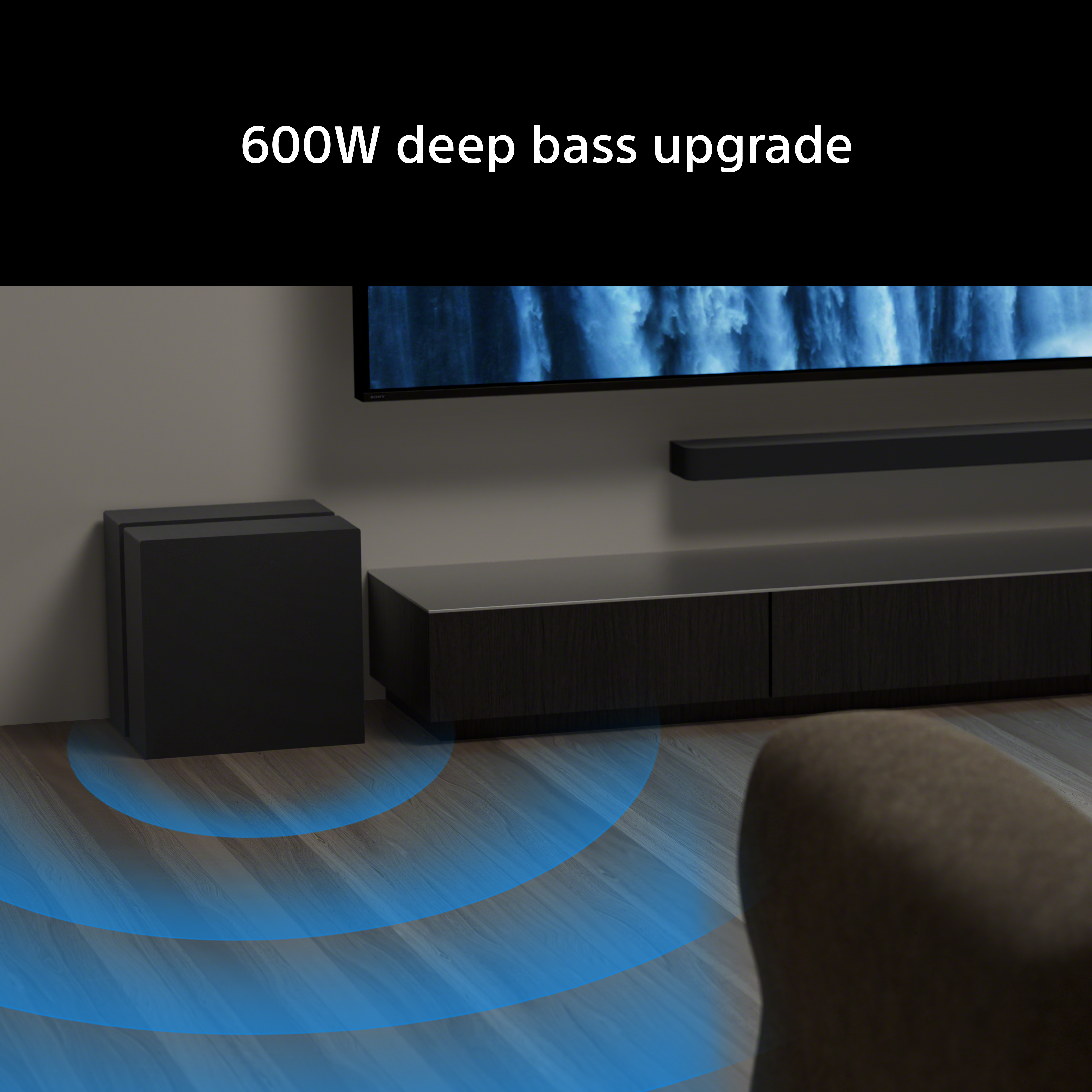Caisson de basses noir avec ondes sonores bleues sur plancher en bois.