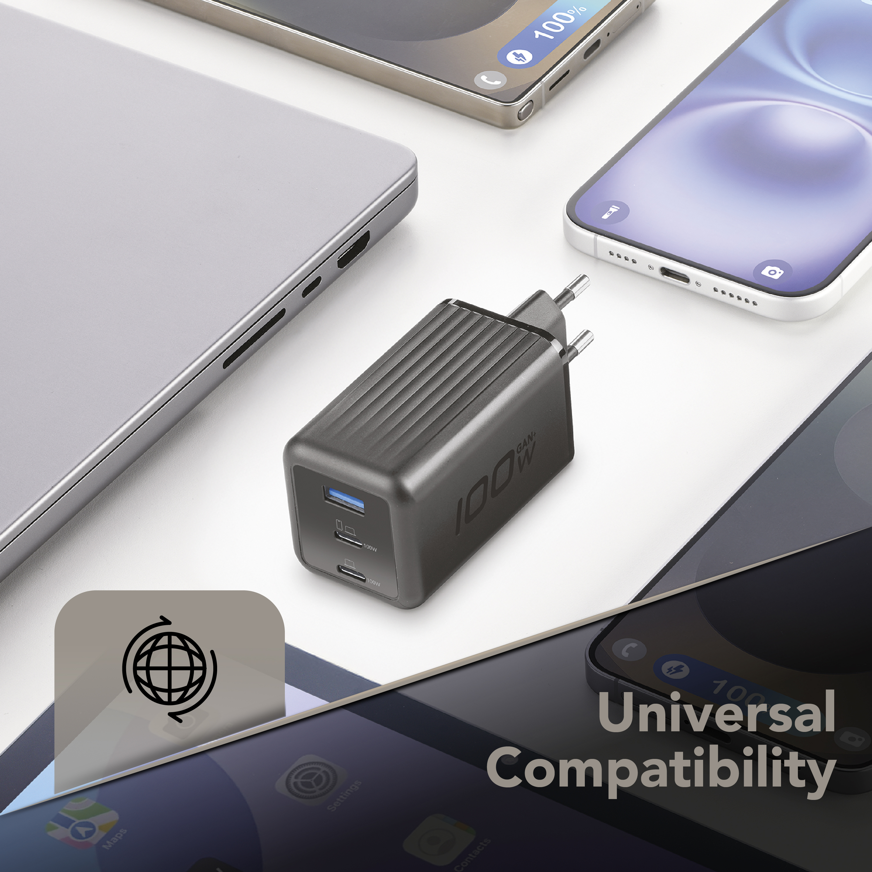 Un cargador negro de 100W con puertos USB-C y USB-A, rodeado de smartphones y un portátil.