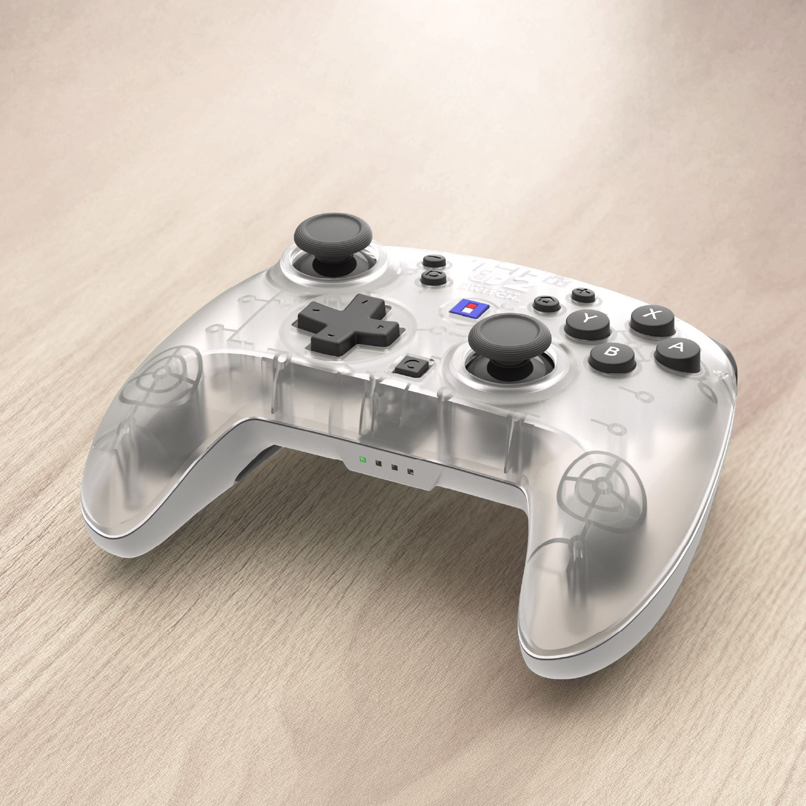 Ein transparenter Controller mit schwarzen Knöpfen auf einem Holztisch.