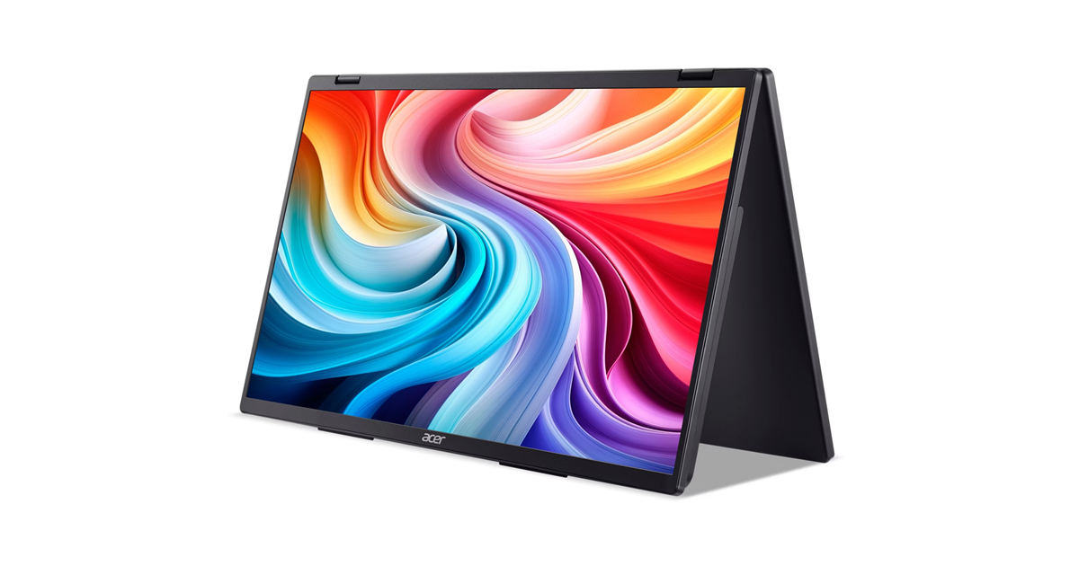 Egy fekete laptop sátor módban színes, absztrakt háttérképet jelenít meg.