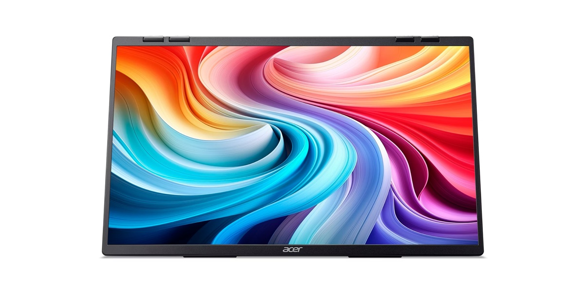 Egy kinyitott laptop színes, örvénylő háttérképet jelenít meg a képernyőjén.