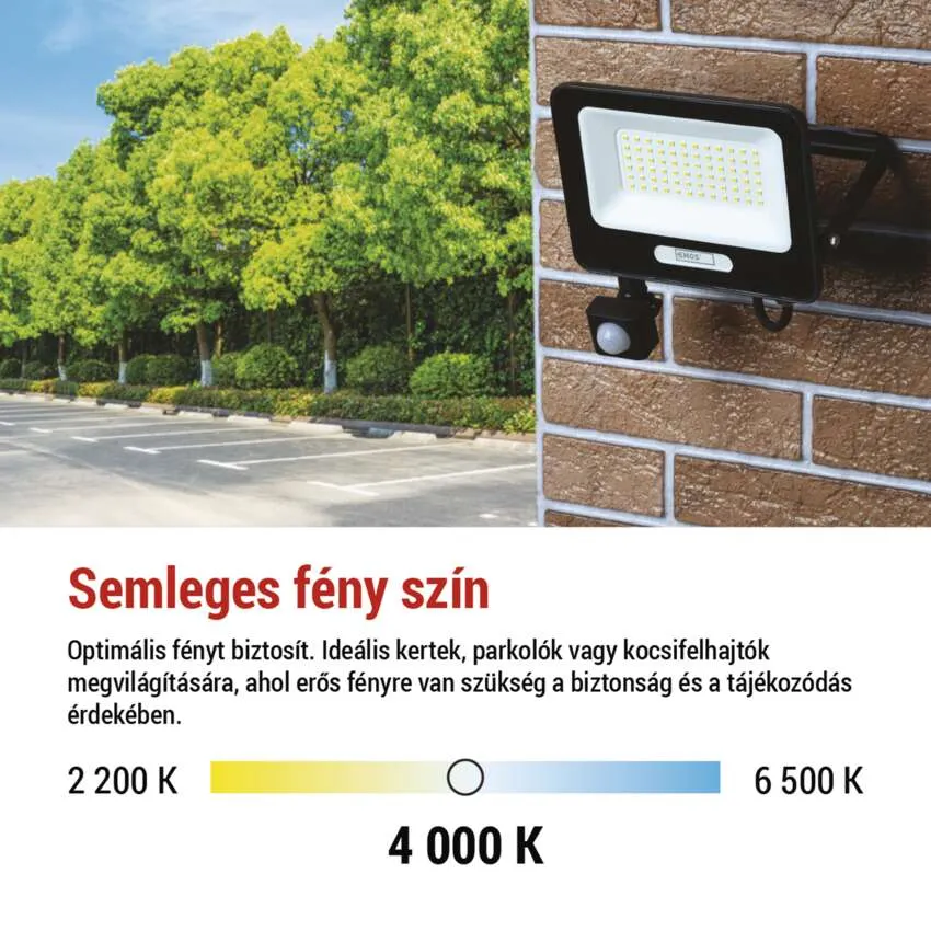 Téglafalra szerelt kültéri lámpa, parkolóval a háttérben.
