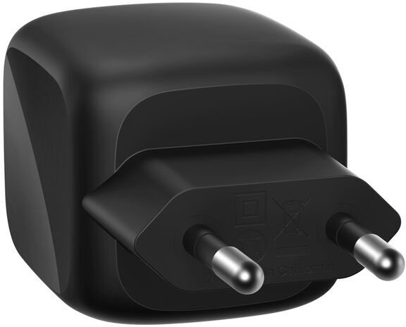 Un adaptador de enchufe negro con dos clavijas metálicas.