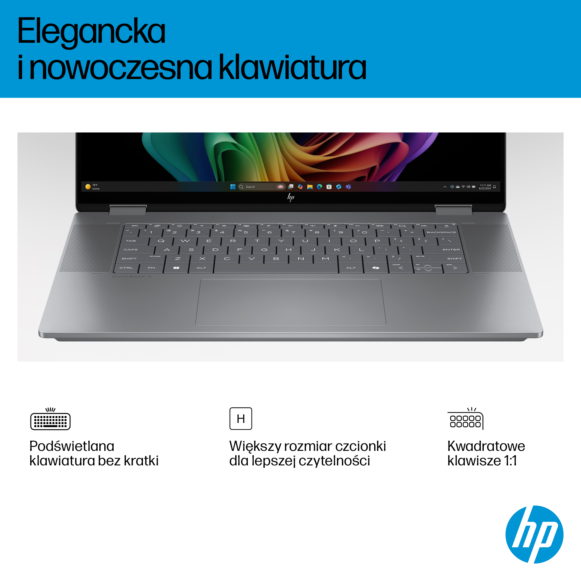 Srebrny laptop z podświetlaną klawiaturą i kolorową tapetą.