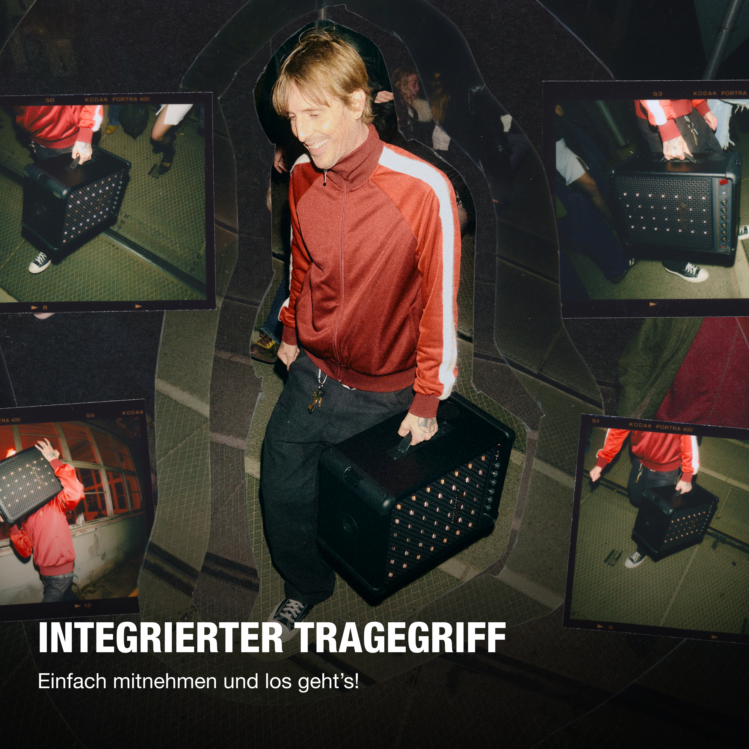 Ein Mann im roten Trainingsanzug trägt eine schwarze Box mit Lichtern.