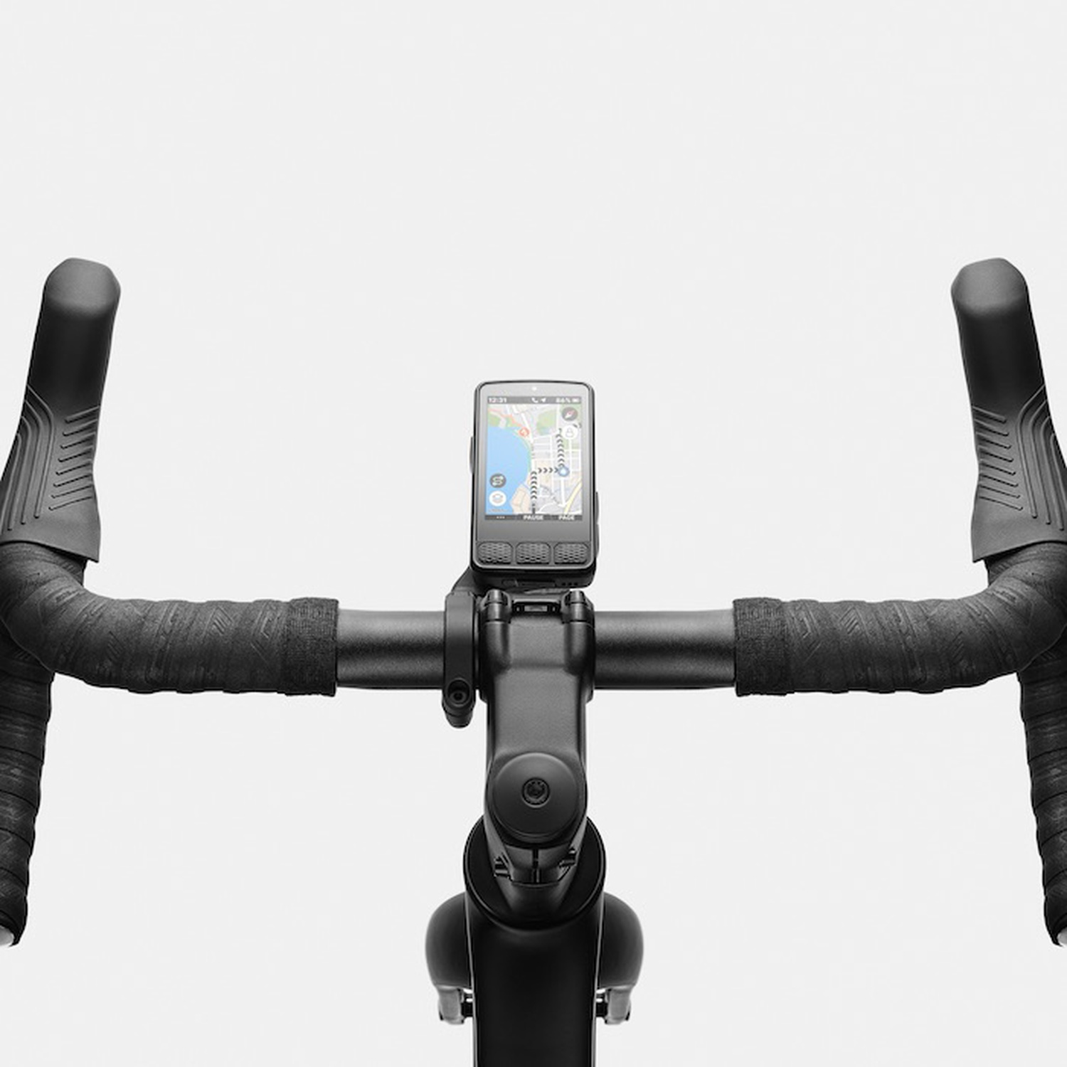 Close-up of a black bicycle handlebar with a GPS device showing a map.